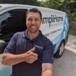 Owner of SimpliHome posing next to his air duct cleaning van.