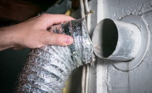 dryer vent flex hose being removed