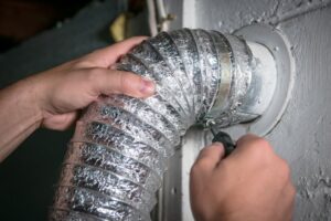 reinstalling dryer vent flex pipe to wall